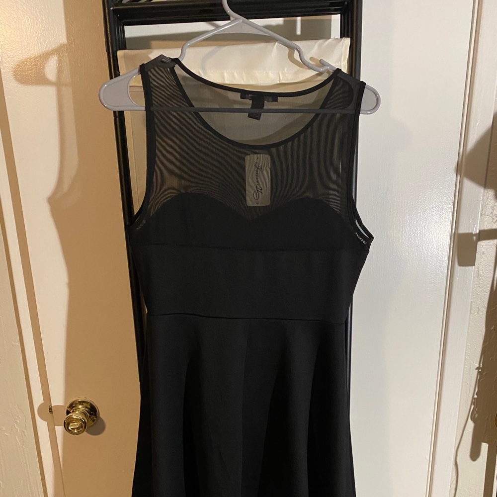 Black peplum with sheer detail dress